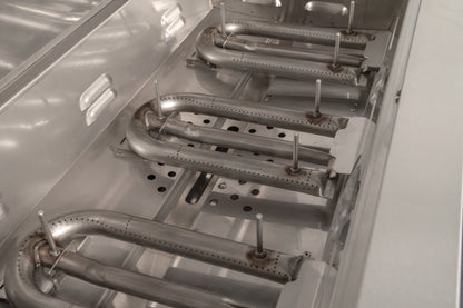 AOG Stainless Steel Burners installed in the lower housing of the grill body