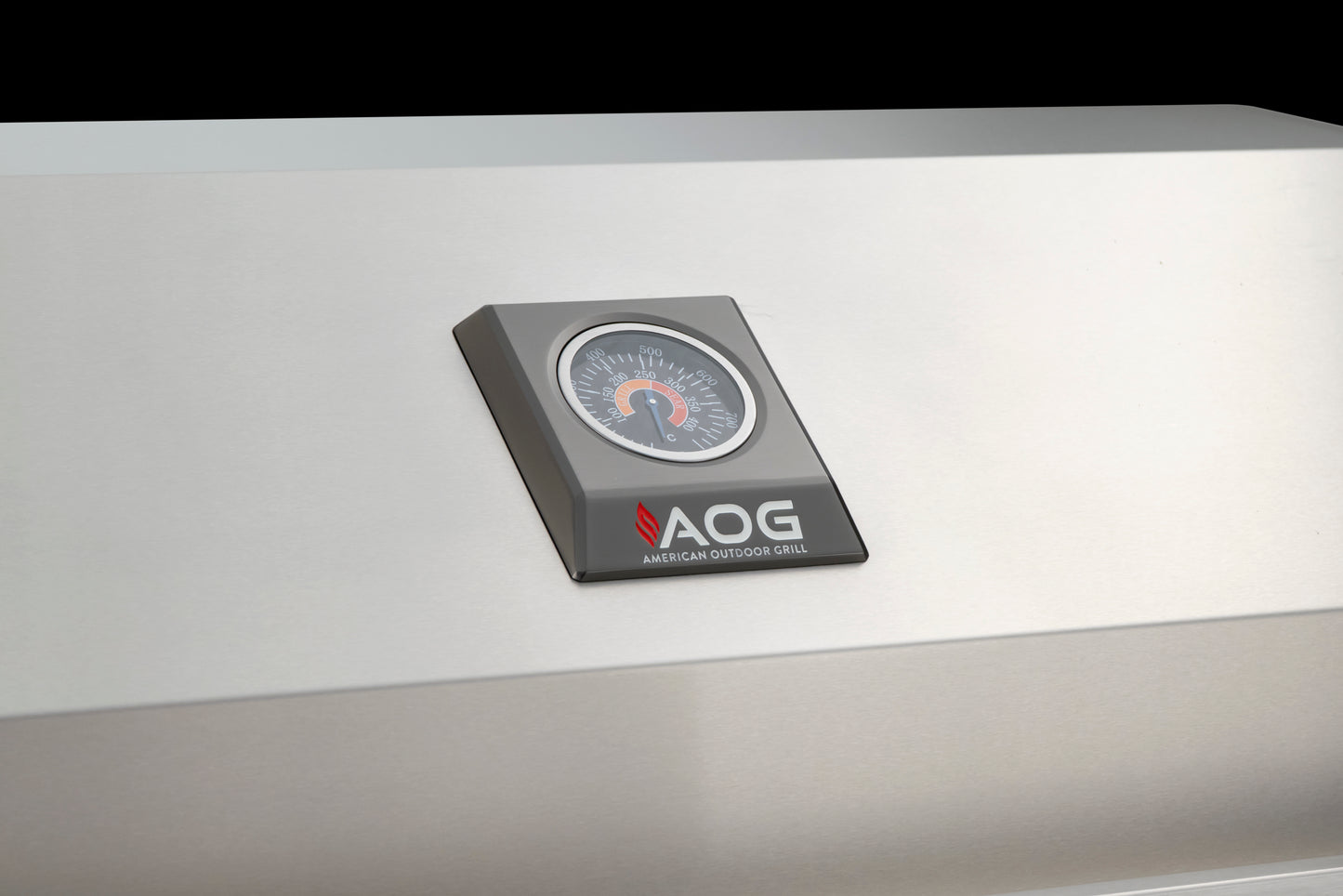 The aog temperature gauge on the front of the grill lid