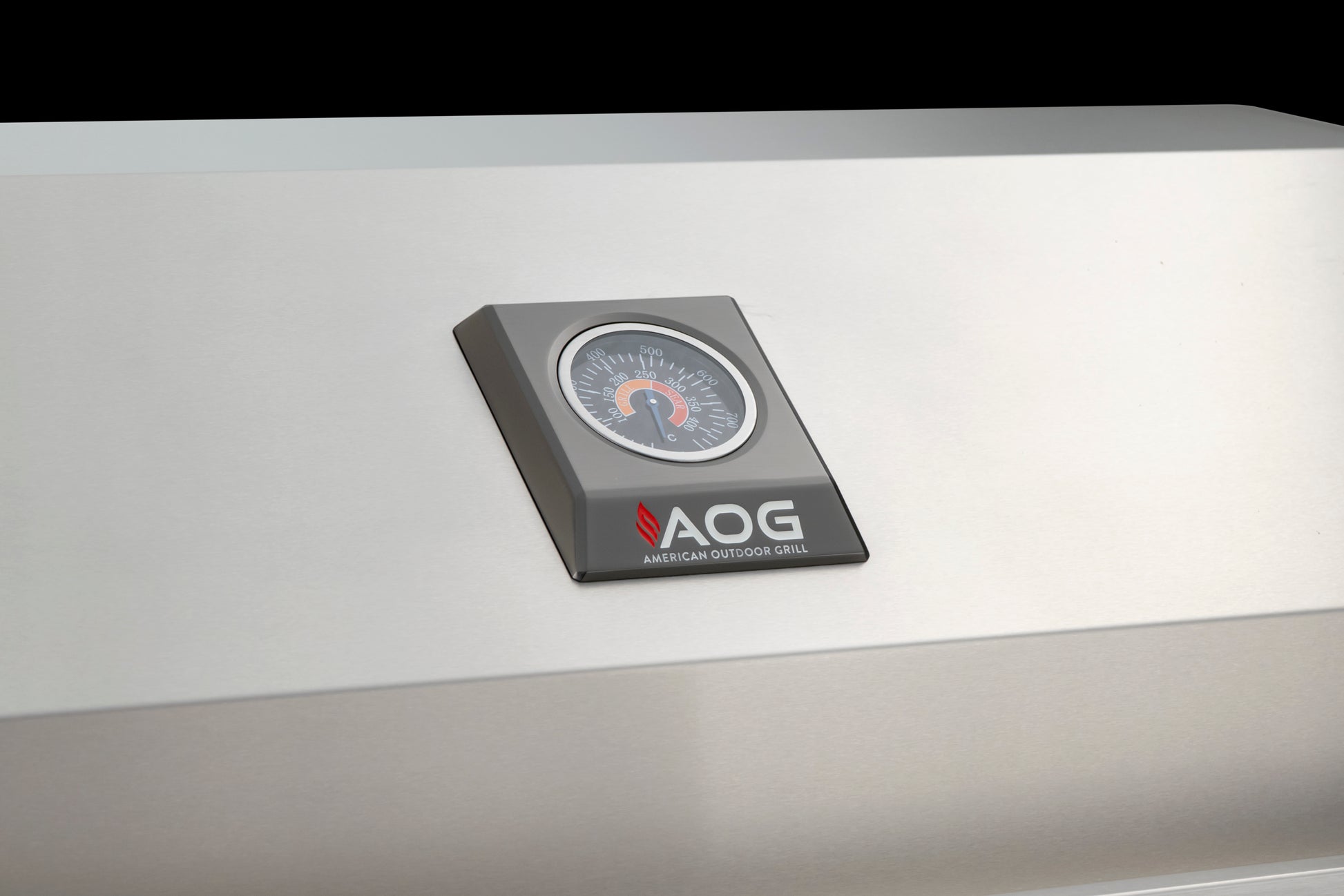 The aog temperature gauge on the front of the grill lid